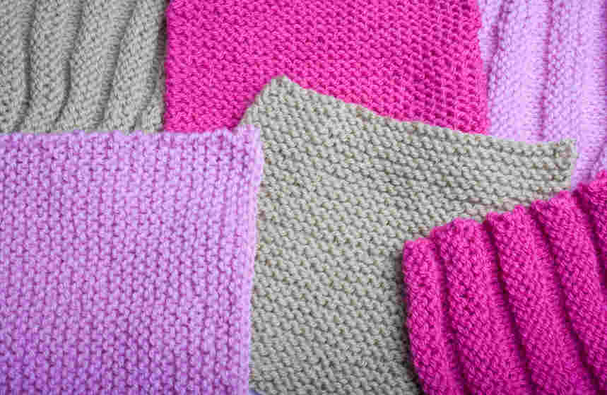 Samples of knitted tension squares arranged