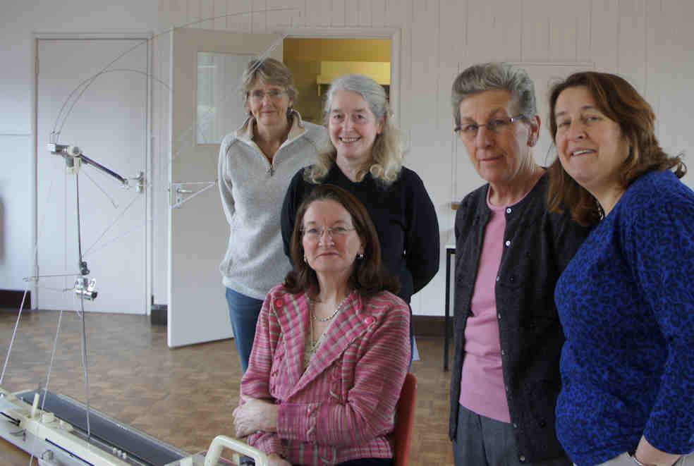 Group of student around the tutor at the knitting classes