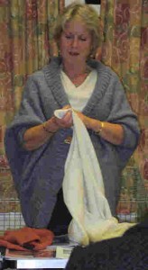 An image of Ann Brown showing the club her knitting