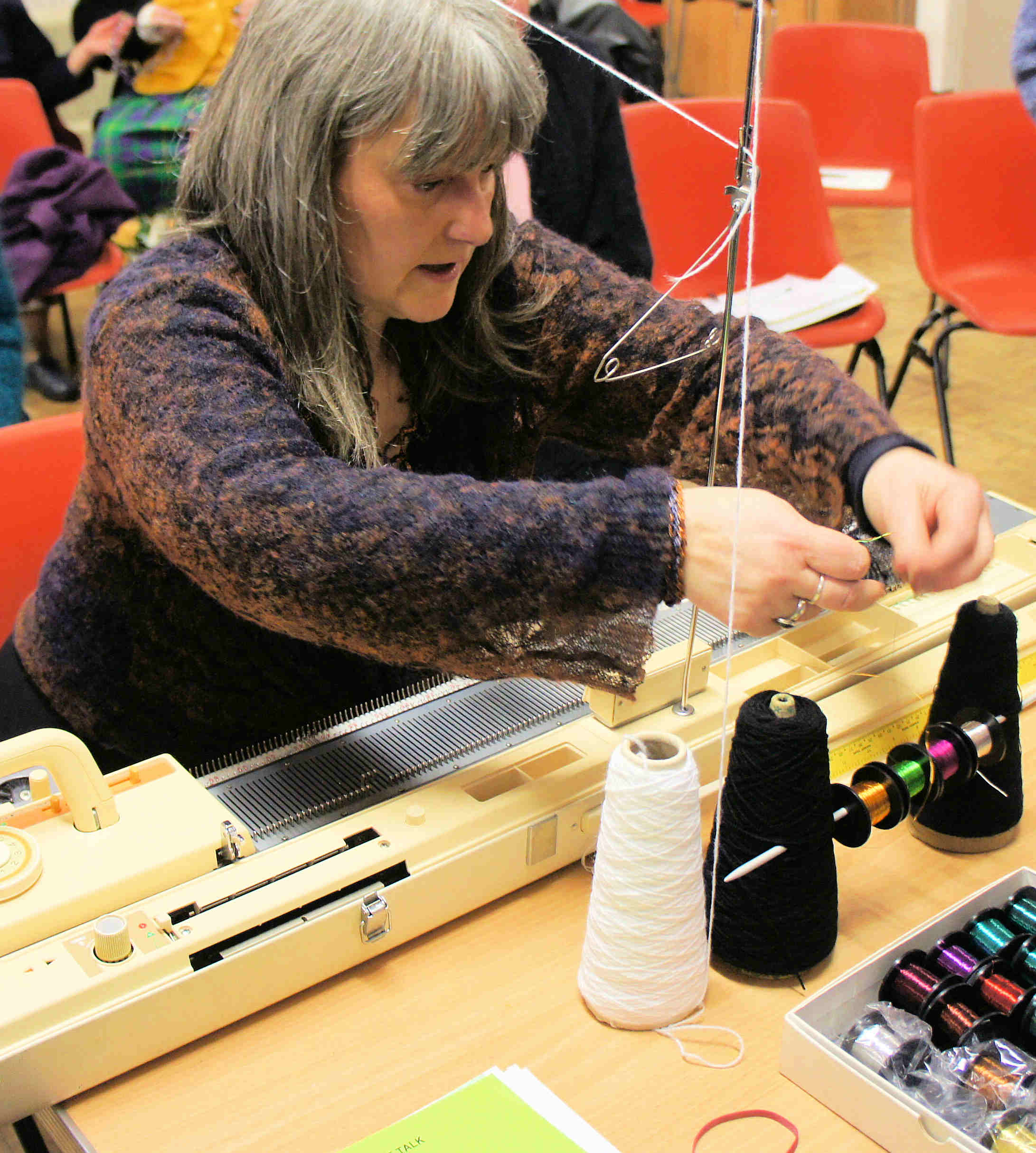 Erica demonstrating how to knit with wire