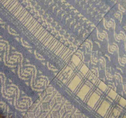 Detail of blue and white cushion cover
