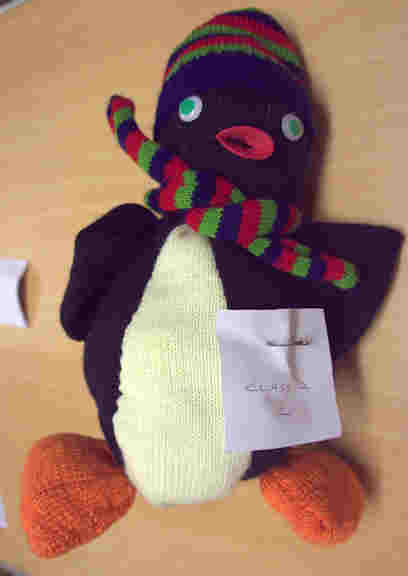 knitted penguin with stripey scarf