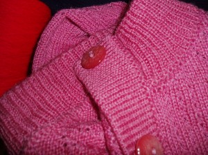 Showing how the button band overlaps the neckband