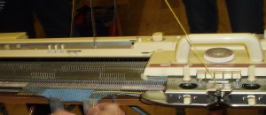 Using hold position to do waste knitting at pocket bottom position.