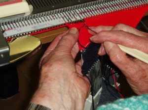 Picking up the button hole stitches on the "return" part of the band