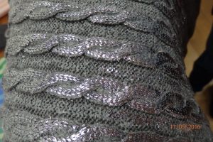 Cabled item with silvery thread incorporated